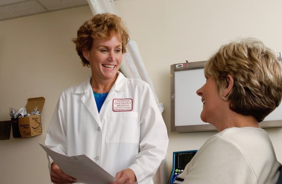 A doctor reviewing notes with a patient during a friendly consultation